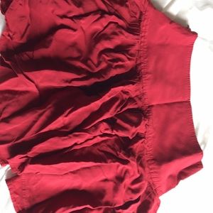 Mid length skirt. Dark red color